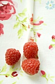 Raspberries on patterned spoon