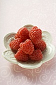 Raspberries in small white dish