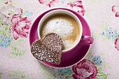 Cup of cappuccino with chocolate heart