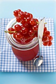 Redcurrants on a jar of redcurrant jelly