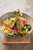 Chicken legs with saffron rice & pomegranate seeds (Asia)