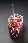 Gooseberry jam in jar with spoon
