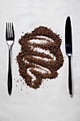 Grated chocolate between knife and fork
