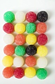Many coloured jelly sweets in rows