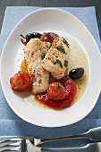 Monkfish fillets with cherry tomatoes and olives