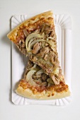 Two slices of tuna and onion pizza on paper plate