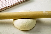 Rolling out pizza dough