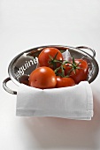 Fresh tomatoes in a colander