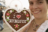 Woman with Lebkuchen heart (Oktoberfest, Munich)