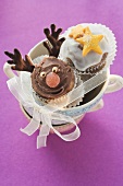 Christmassy chocolate muffins in a pile of cups