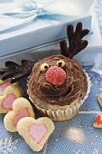 Christmassy chocolate muffin and heart-shaped biscuits