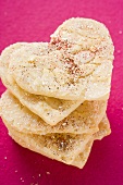 Almond hearts with sugar, in a pile