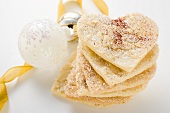 Almond hearts with sugar, in a pile, Christmas bauble