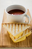Toasted cheese sandwiches & a cup of tomato soup on board