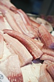 Fresh fish fillets on a market stall