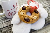 Gingerbread tree ornament, fur mittens and cup