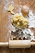 Biscuit dough, biscuit cutters, flour, egg and rolling pin