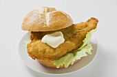 Breaded fish fillet and mayonnaise in bread roll