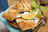 Pide (Turkish flatbread) with sheep's cheese filling