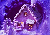 Gingerbread house in purple light