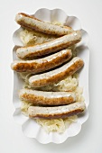 Sausages with sauerkraut in paper dish