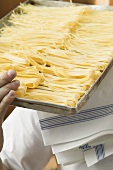 Home-made pasta on baking tray