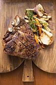 Grilled T-bone steak with vegetables