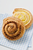 Two coiled buns on checked napkin