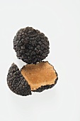 Black truffles, whole and halved