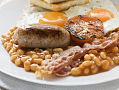 Baked beans, sausage, bacon, tomato, fried eggs and toast