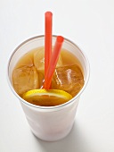 Iced tea with lemon and straws in plastic cup