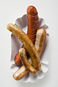 Sausages (bratwursts) in paper dish
