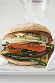 Toasted roll filled with grilled vegetables