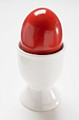 Red Easter egg in egg cup