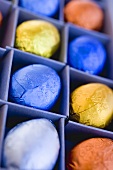 Chocolate eggs in coloured foil, in box
