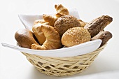 Bread rolls and croissants in bread basket