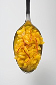 A spoonful of saffron risotto (overhead view)