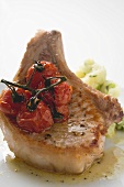 Fried pork chop with cherry tomatoes and mashed potato