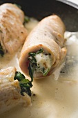 Veal rolls with spinach stuffing in cream sauce