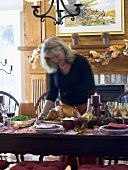 Woman serving stuffed turkey for Thanksgiving (USA)