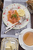 Smoked salmon, tea, butter and toast