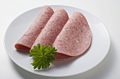 Three slices of Bierwurst (beer sausage) on plate