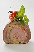 Stuffed pork roulade with herbs and cherry tomato