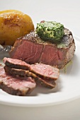 Beef steak with herb butter and baked potato