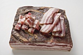 Piece of bacon, diced bacon and slices of bacon