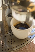 Espresso cup on espresso machine