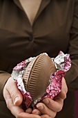 Woman holding a chocolate Easter egg