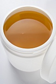 Honey in plastic container