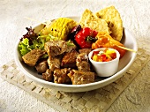 Grilled beef with vegetable kebab, salsa and flatbread
