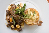 Braised goose leg with pear and onion tart